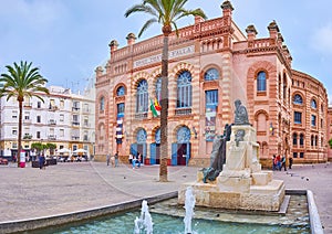 Cayetano del Toro monument against the Gran Teatro Falla theatre, Cadiz, Spain photo