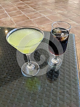 Cayo Coco, Cuba, May 16, 2021: Two cocktails in glasses stand on a table in a hotel lobby