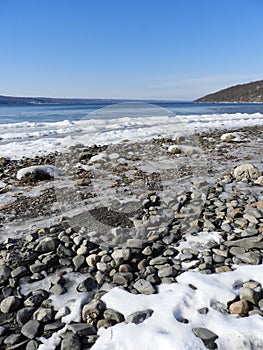 Cayuga Lake frozen waves and stone shoreline