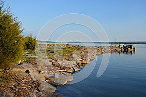 Cayuga Lake rock jetty and dock at Long Point State Park photo