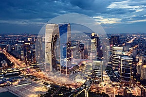 CBD buildings by Jinji Lake at night in Suzhou, China