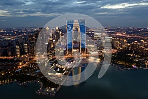 CBD buildings by Jinji Lake at night in Suzhou, China