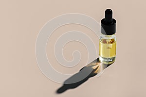 Legalized CBD oil in clear, glass container with dropper lid isolated background