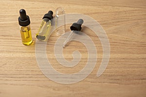 CBD oil in a glass vial with a pipette