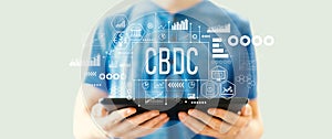 CBDC theme with man using a tablet