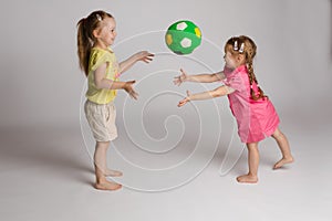 Ccheerful kids throwing and catching ball. Concept of happiness and game.