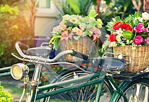 Cclose up vintage bicycle with bouquet flowers in basket