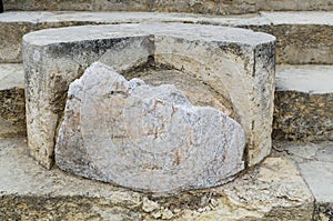 CCRETE, GREECE - November, 2017: Close-up: fragment of a column lying on the steps in the Minoan Palace of Knossos