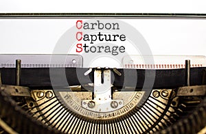 CCS Carbon capture storage symbol. Concept words CCS Carbon capture storage typed on old retro typewriter. Beautiful white