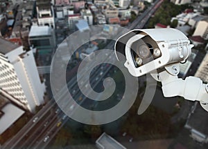 CCTV with Blurring City background.