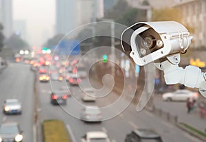 CCTV with Blurring City in background.CCTV with Blurring City in background.CCTV Security camera with blurring traffic jam in chen