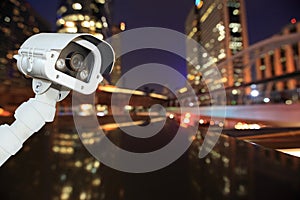 CCTV with bokeh blurring city in night background.