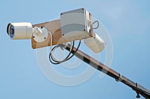 CCTV camera against the blue sky