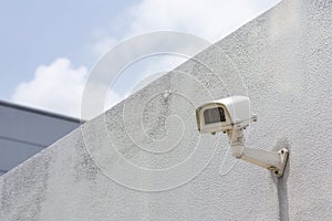 The CCTV camera attach at the concrete wall.