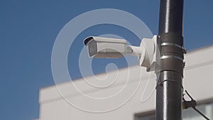 CCTV camera on a black park pole. remote security surveillance system. area. control of order by security authorities.