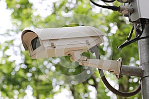 CCTV camera digital video recorder in public park.