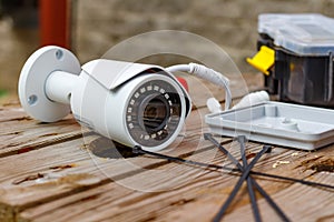 CCTV camera and expendable materials for mounting on a wooden surface