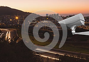 CCTV camera on illuminated road in city