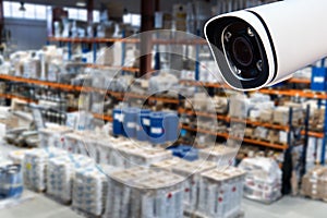 CCTV Camera Operating inside warehouse. On a broken background