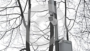 CCTV camera in a public park in winter. On a pole, a surveillance camera for safety in a public place