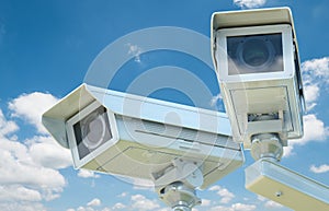 Cctv camera or security camera on blue sky background