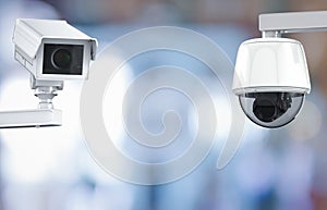 Cctv camera or security camera on retail shop blurred background