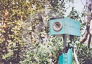 CCTV camera security hidden in the bushes.