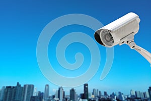 CCTV Camera security operating with buildings blur background