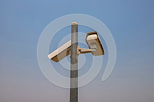 CCTV camera in security system in urban city with sky background in security concept