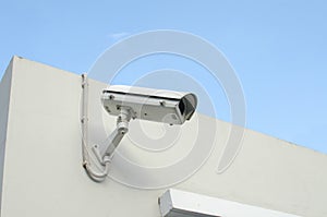 CCTV camera on a wall watch rigth