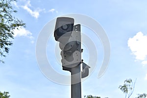 CCTV cameras installed on a pole and equipped with waterproof cover.  Security system background.