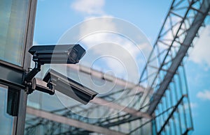 CCTV cameras on the side of a modern building