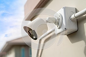 CCTV Closed circuit camera at wall house, security system concept