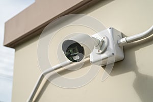 CCTV Closed circuit camera at wall house, security system concept