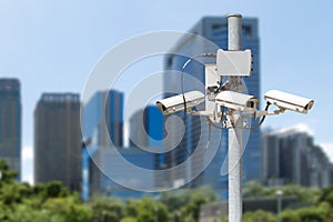 CCTV pillar with the building in the city background