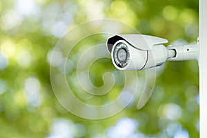 CCTV security with blurry green bokeh background