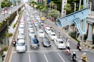 CCTV Security camera with blurring traffic jam in bangkok city