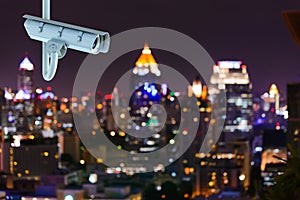 CCTV Security camera with bokeh lights of Bangkok city.