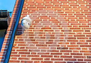 CCTV security camera in front of an office building in the city with copy space