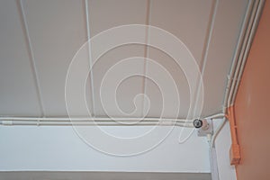 CCTV security camera installed on ceiling building