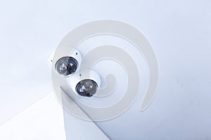 CCTV security camera installed on the white ceiling