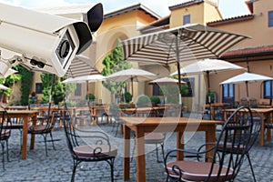 CCTV Security Camera operating in the restaurant blur backgroun