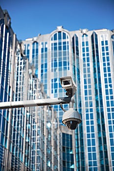 A CCTV surveillance camera in a modern city photo