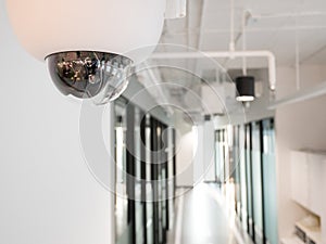 CCTV or surveillance operating in office building blur background.