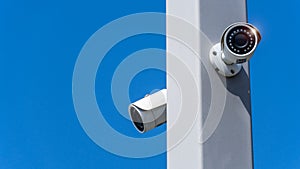 CCTV surveillance security camera video equipment on pole outdoor area safety system area control and copy space