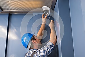 Cctv technician fixing camera