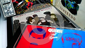 CD albums of the famous English group QUEEN. selective focus on album THE WORKS