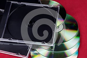 CD Cases and CDs on a Red Background