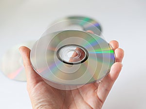 Cd compact disc in the hand on white background
