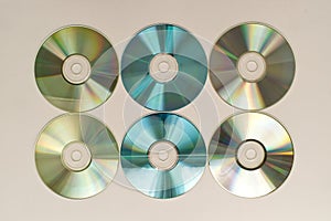 CD and DVD disk on white background. Technology from the 90s